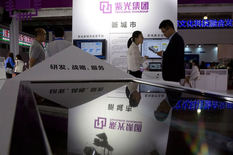 2018 年 5 月 17 日，第 21 届中国北京国际​科技产业博览会，紫光集团展台。 （美联社）