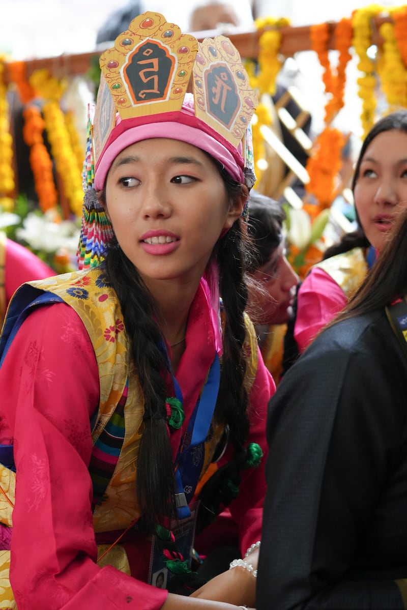 A devotee listens during celebrations on the 90th birthday of the Dalai Lama at the Main Temple in Dharamsala, India, July 6, 2025.
