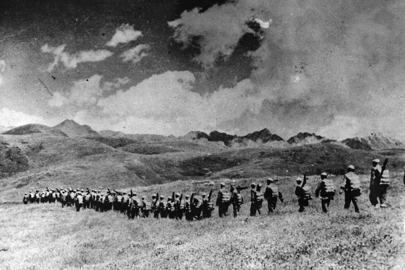 Chinese troops march over the highlands toward the Tibetan frontier after their invasion of Tibet in 1950.
