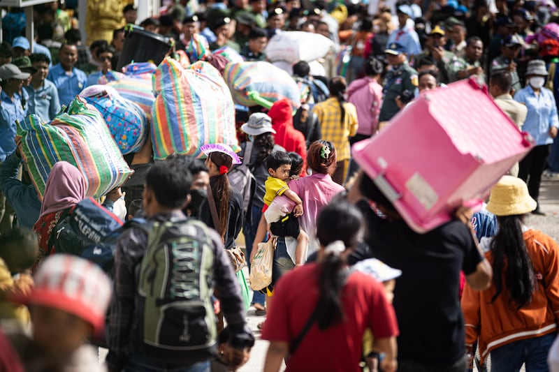 Cambodian migrant workers cross the Ban Laem border checkpoint in large numbers with all of their belongings on July 29, 2025 in Chanthaburi, Thailand.