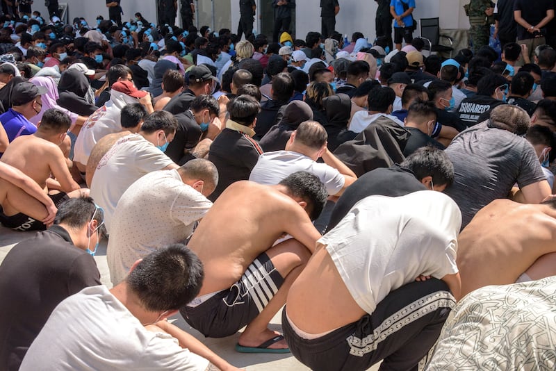 Victims of scam centers who were tricked or trafficked into working in Myanmar, during a clearing operation at a compound on the Thailand-Myanmar border in Myawaddy, Myanmar, Feb. 26, 2025.