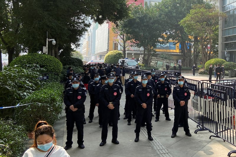 Police officers stand guard outside the Evergrande International Center in Guangzhou, Guangdong province, China, Jan. 4, 2022. Credit: David Kirton/Reuters
